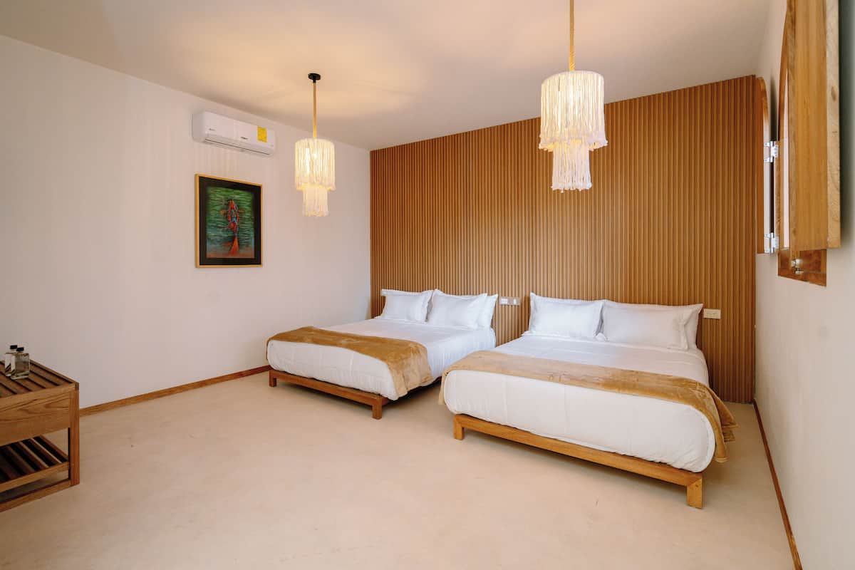 Habitación cuádruple Deluxe | Ropa de cama de alta calidad, wifi gratis y ropa de cama