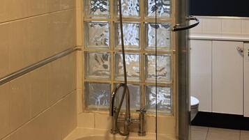 Combined shower/tub, deep soaking tub