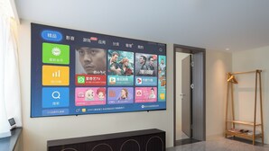 A digital display with various app icons and categories.