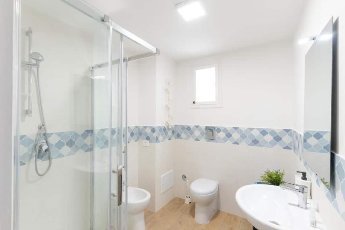 Deluxe Apartment, Courtyard View | Bathroom | Shower, hair dryer, towels, soap