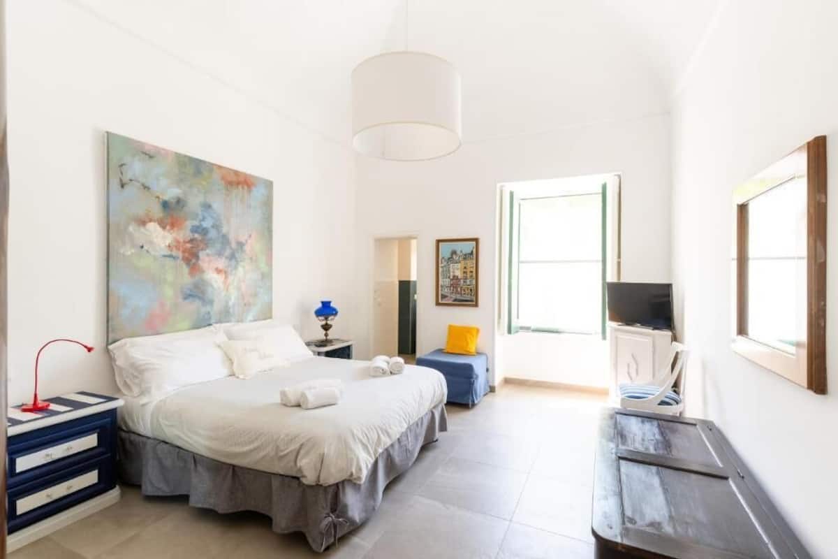 Deluxe Quadruple Room, Garden View | Blackout drapes, free WiFi