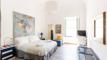 Neljän hengen deluxe-huone, näköala puutarhaan | Pimennysverhot, ilmainen Wi-Fi
