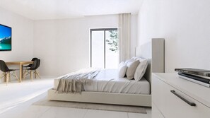 Quarto moderno com cama, escrivaninha e televisão.
