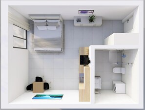 Ein modernes, kleines Hotelzimmer mit Bett, einer kleinen Küchenzeile, einem Badezimmer mit Toilette und Waschbecken sowie einem großen Fenster.