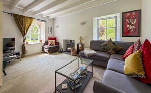TV, fireplace, books - Charming Foresters Cottage in Blair Castle Estate (North Ayrshire Council)