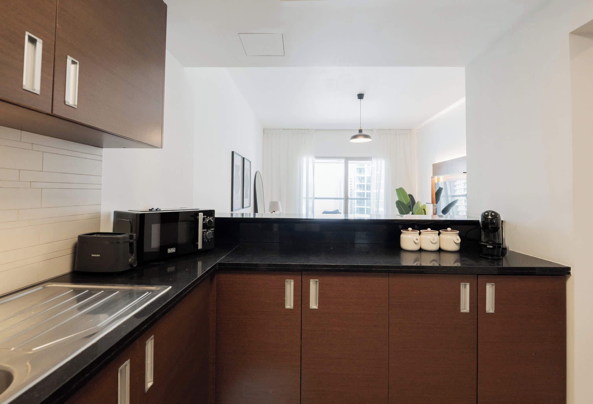 Coffee/tea maker, fridge, microwave, oven