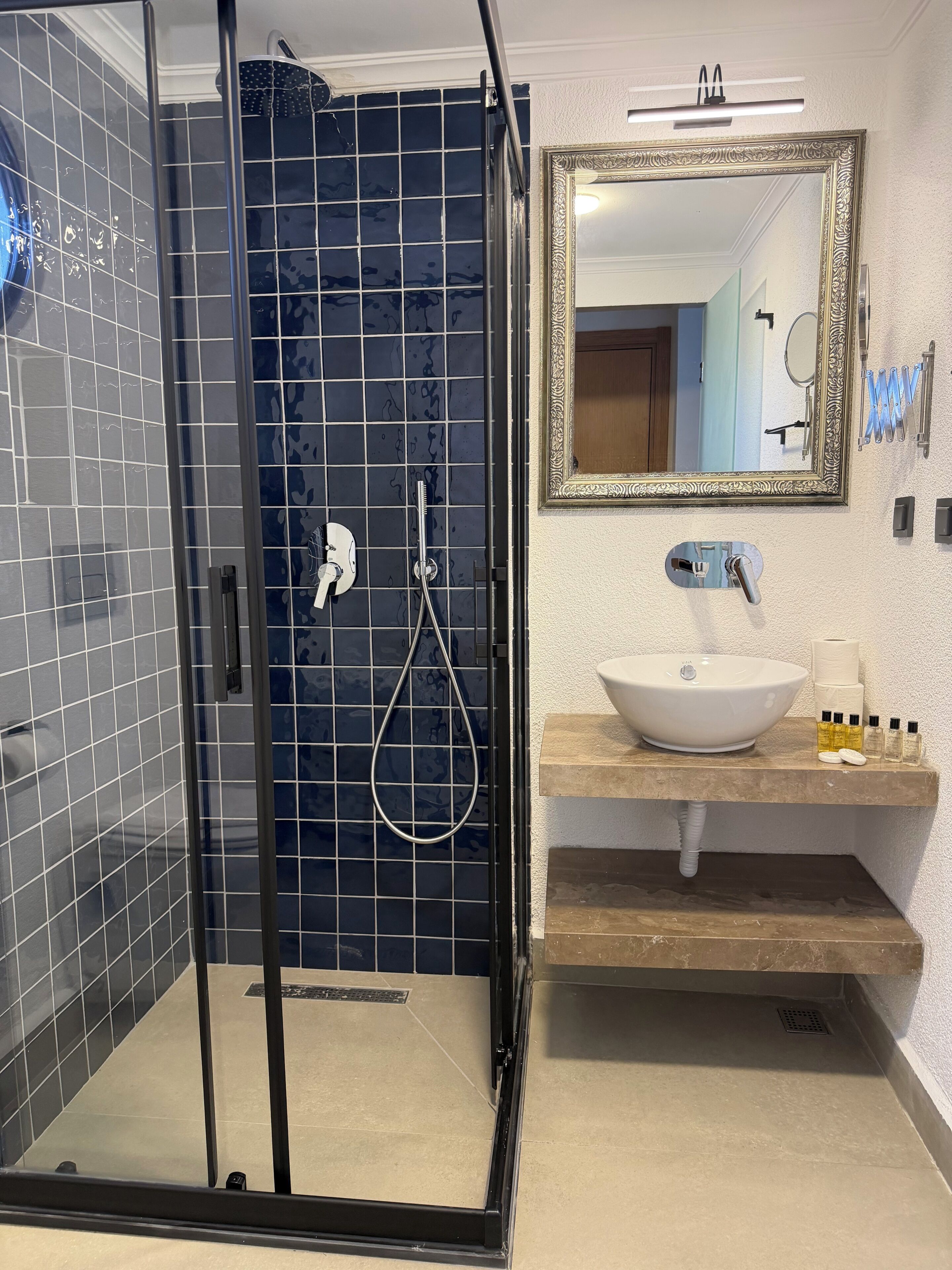 Shower, hair dryer, slippers, towels