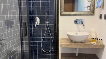 Shower, hair dryer, slippers, towels