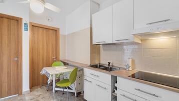 Fridge, stovetop, highchair, cookware/dishes/utensils
