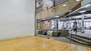 A gym with a basketball hoop, exercise equipment, and seating area. - Luxury WP Mtn Cabin, Free Shuttle, Views & Garage (Fraser)