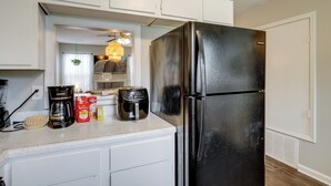 A kitchen with a black refrigerator, a coffee maker, and a toaster on the counter. - Walk to Park w/ Pond, Trails & More! Sherwood Unit (Sherwood)