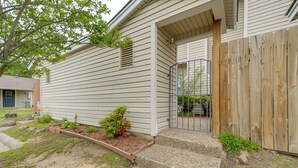 A residential house with a front porch, a wooden fence, and a small garden area. - Walk to Park w/ Pond, Trails & More! Sherwood Unit (Sherwood)