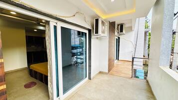 Deluxe Quadruple Room, City View | Desk, free WiFi