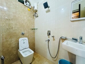 Deluxe Quadruple Room, City View | Bathroom | Shower, free toiletries, towels - Annapurna Prestine Puri (Puri)