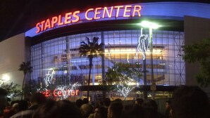 The Staples Center with a large glass facade and a prominent 'Staples Center' sign. - Crimson Hotel (Manhattan Beach)