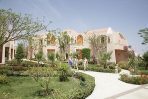 A resort with multiple buildings, a central pathway, and well-maintained gardens. - Shams Alam Beach Resort (Marsa Alam)