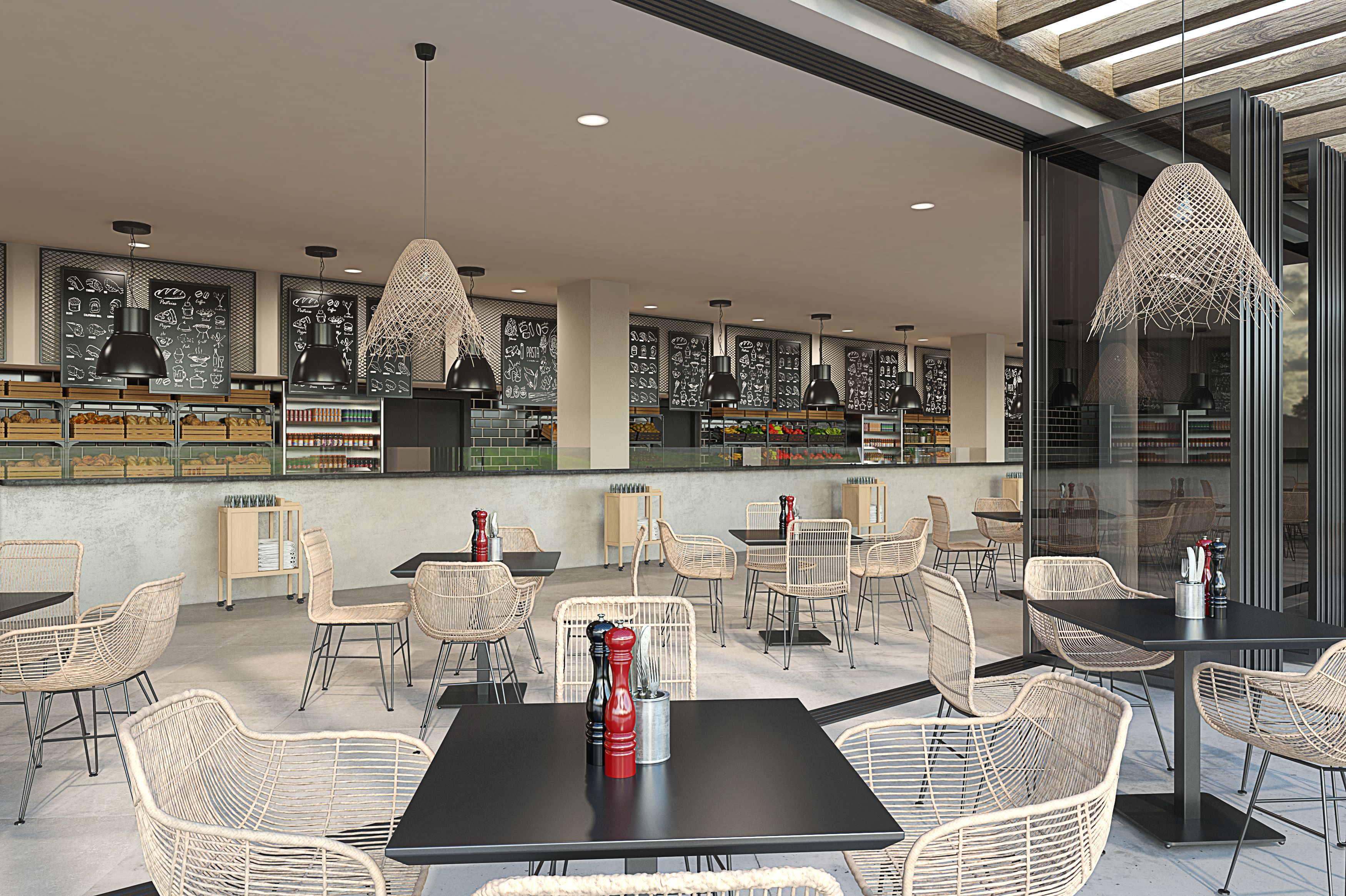 A restaurant with wicker chairs, black tables, and pendant lighting.
