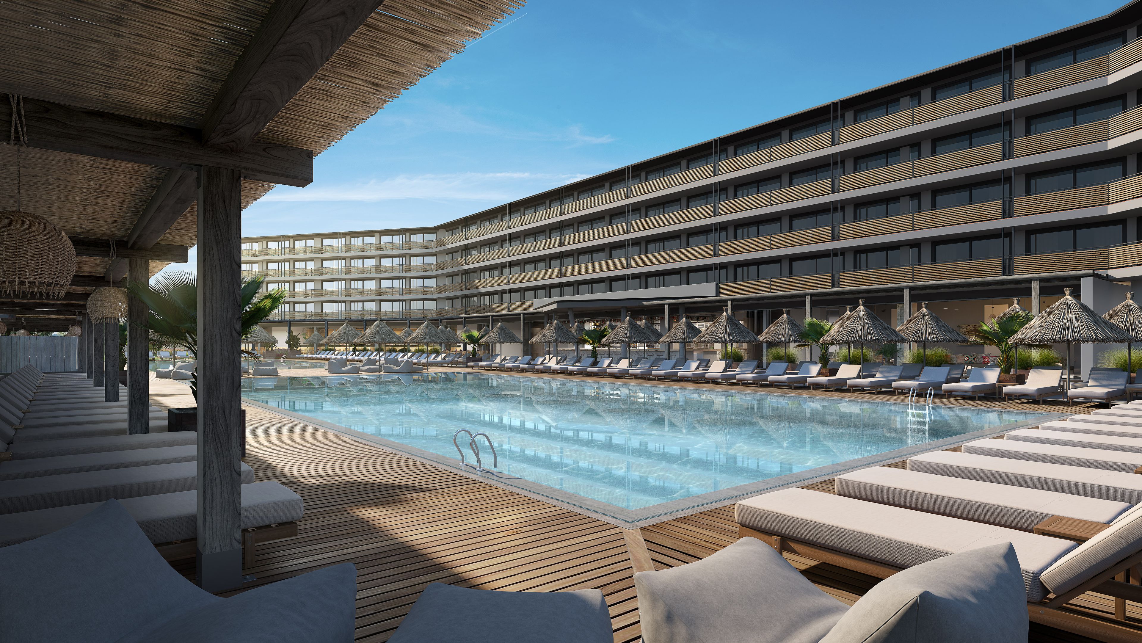 Ett modernt hotell med en stor pool, solstolar och ett avskärmat område med parasoller.