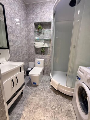 Shower, hair dryer, towels, soap