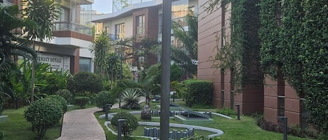 Comfort Apartment, Balcony, Pool View | Property grounds