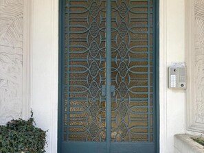 A blue door with intricate metalwork and a keypad lock. - Cozy apartment in city centre - 2 guests (Vichy)