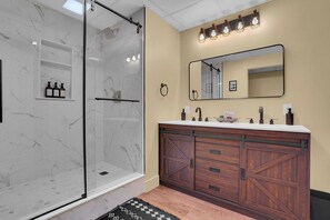 Shower, hair dryer, towels, soap