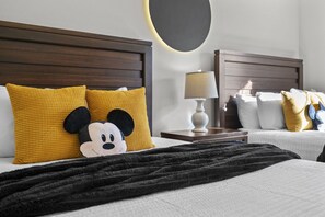 A hotel room with two beds, a Mickey Mouse plush toy, and a lamp on a bedside table. - Last Minute Disney Getaway! Modern Townhouse. Book Now! #166743 (Orlando)