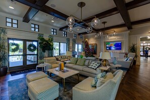 A spacious living area with a large sofa set, a coffee table, and a television. - Last Minute Disney Getaway! Private Pool, Game Room & Themed Bedrooms. Book Now! #172899 (Orlando)