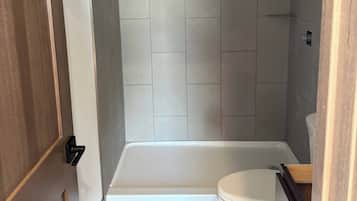 Shower, hair dryer, towels, shampoo