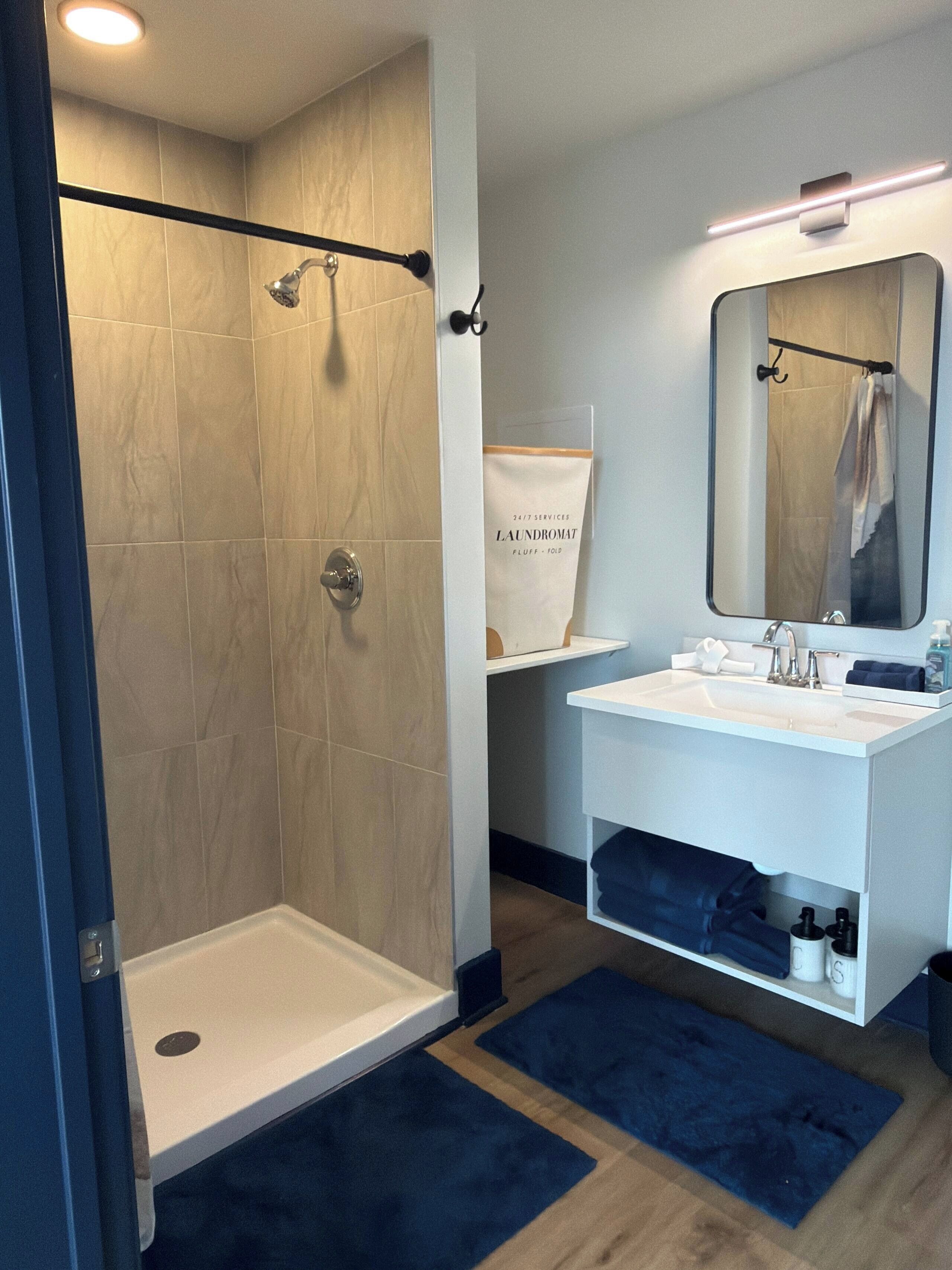 Shower, towels, soap, toilet paper