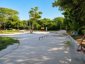 A skate park with concrete ramps, railings, and a signboard. - Modern Flat in Zicatela • 100m from the Beach (Oax.)