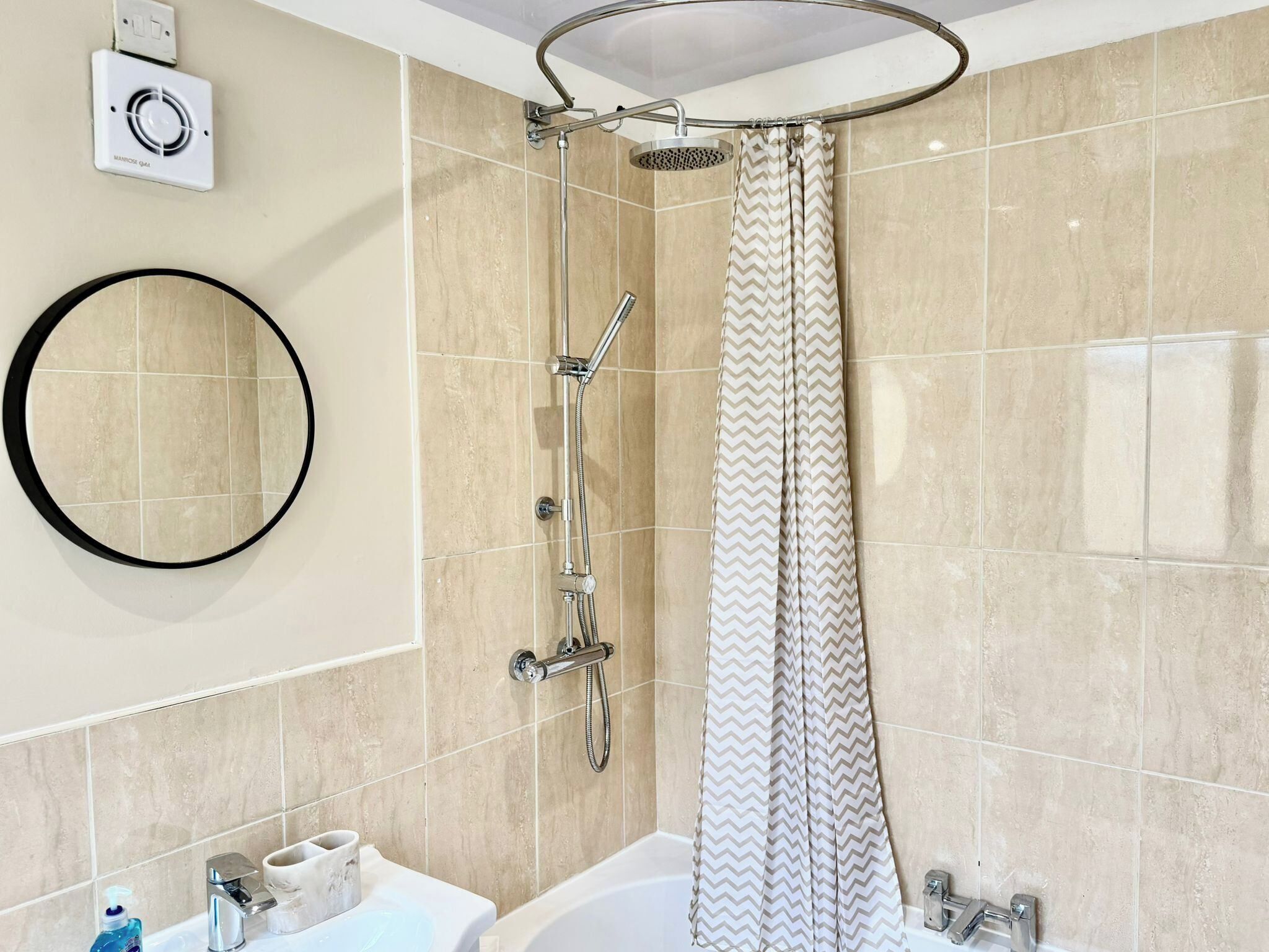 Combined shower/bathtub, deep-soaking bathtub, towels