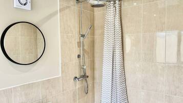 Combined shower/bathtub, deep-soaking bathtub, towels