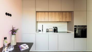 Exclusive Apartment, 1 Bedroom, Patio | Private kitchen | Fridge, oven, stovetop, dishwasher