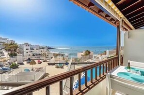 A balcony with a view of the sea and buildings. - Costa Caleta 1 - Two Bed (La Caleta)