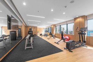 A modern gym with cardio equipment, weight machines, and free weights. - Free housekeeping visits during your stay - StayShort - Chic Modern 1BR that Sleeps 4 at Riviera Beachfront (Meydan)