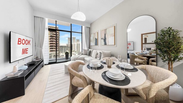 A modern living room with a dining area, large windows, and a view of the cityscape. - StayShort - Modern 1BR that Sleeps 4 at Riviera Beachfront (Meydan)