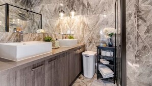 A modern bathroom with two sinks, a mirror, and a shower area. - Private master bedroom + attached ensuite bathroom in a welcoming shared home (Mount Cottrell)