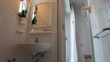 Separate tub and shower, hair dryer, towels, soap
