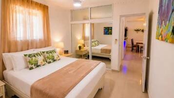 Standard Condo, Pool View | In-room safe, desk, laptop workspace, blackout drapes