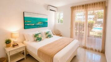 Standard Condo, Pool View | In-room safe, desk, laptop workspace, blackout drapes