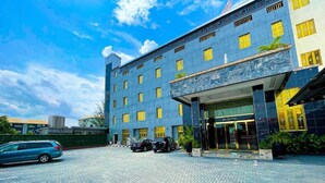 A hotel with a reception area, multiple windows, and a paved entrance. - Julicis Hotels and Suites (Lagos)