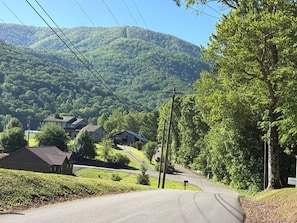 A rural road with houses, a hill, and trees. - Free WiFi, Hot Tub, Jacuzzi, Sunroom (Sevierville)