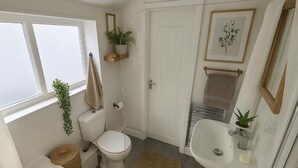A bathroom with a toilet, sink, and bathtub. - Armstrong St - Cosy 3 Bedroom Home (Workington)
