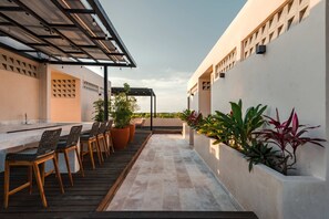 Outdoor dining - Stylish 6BR Villa | 2 pools • Gated Community (Tulum)