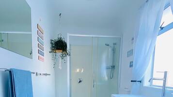 Shower, hair dryer, towels, toilet paper
