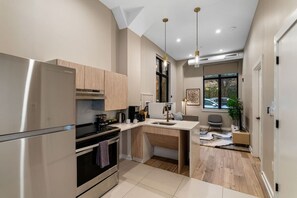 Fridge, microwave, oven, stovetop - The Edison Old City | Accessible 1 BR Suite w/ Shared Roofdeck | Ground Floor (Philadelphia)