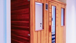 A wooden wardrobe with a mirror and a control panel. - Gorgeous home in Knesselare with sauna (Knesselare)