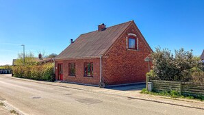A red brick house with a gabled roof, a small window, and a door. - Stunning home in Lemvig with WiFi (Lemvig)