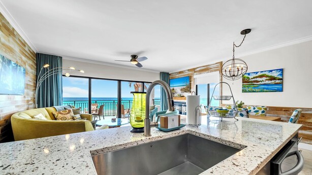 A modern kitchen with a large island, a built-in sink, and a view of the ocean. - The Coastal View Gulf Front Condo in Seagrove Beach Sleeps 7 with a Pool (Santa Rosa Beach)